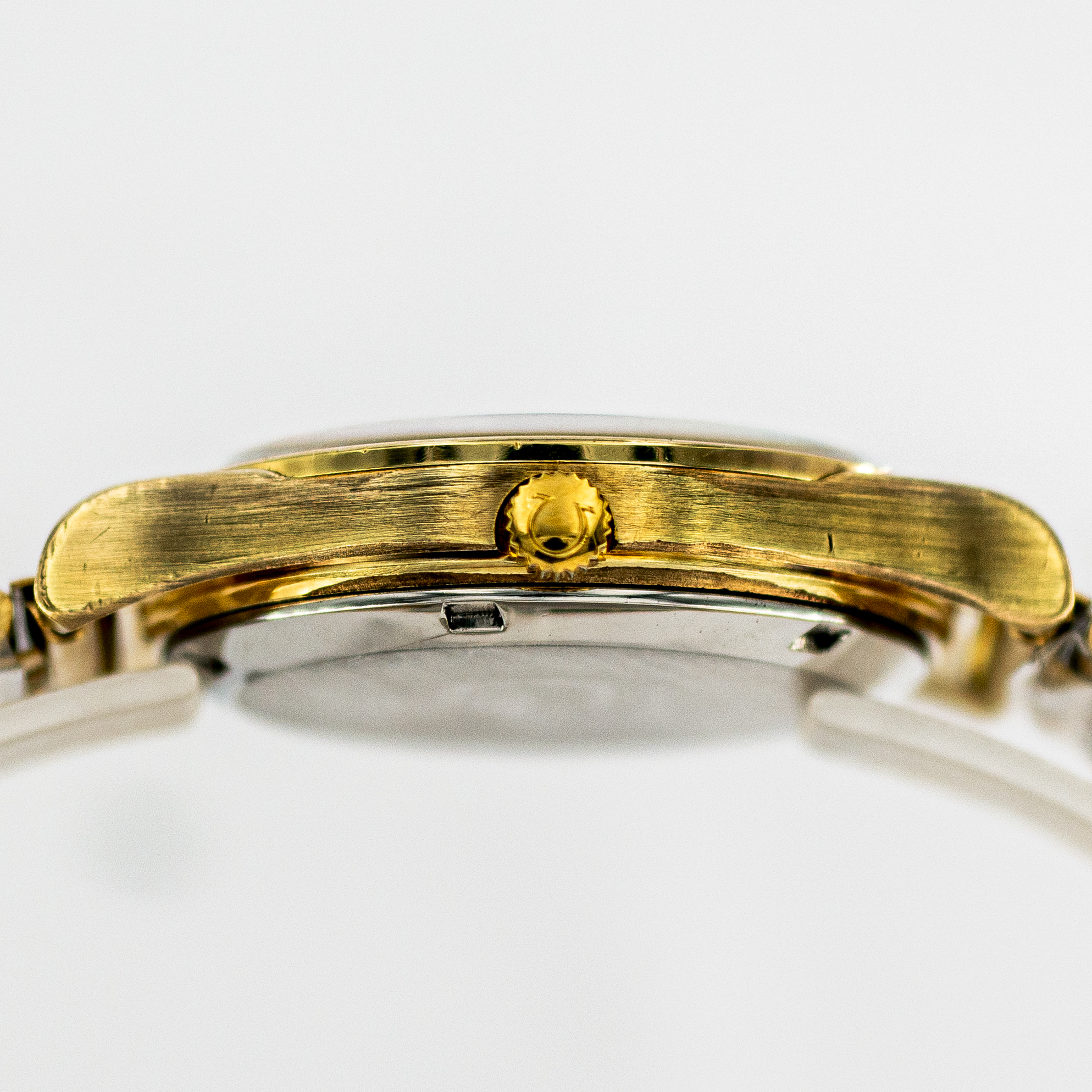 1390_marcels_watch_group_vintage_wristwatch_1973_omega_166.0168_geneve_case_side_06