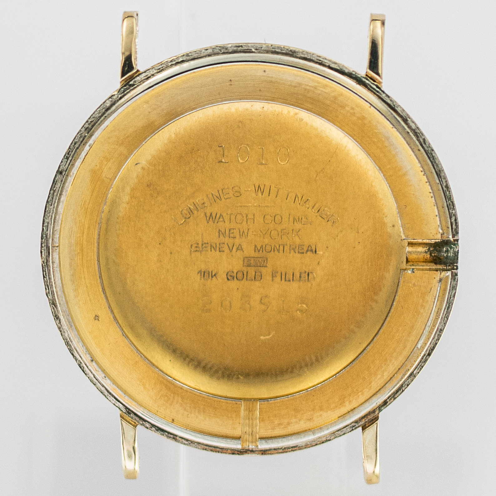 1593_marcels_watch_group_wristwatch_1957_vintage_longines_1010_203915_caseback_01