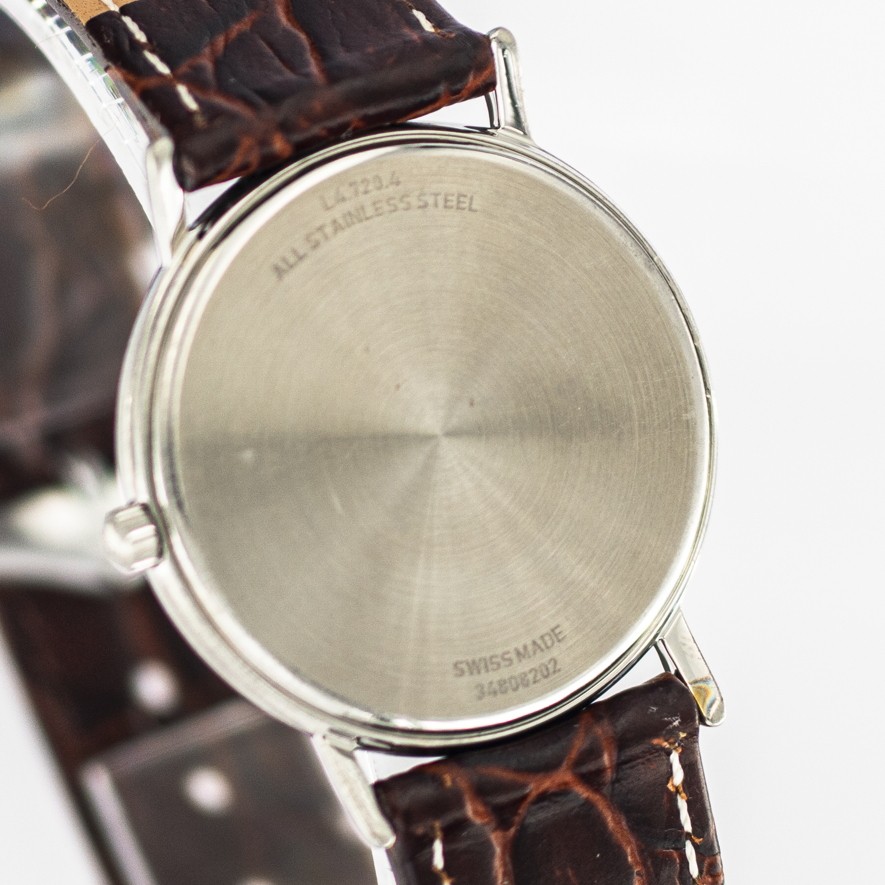 1548_marcels_watch_group_wristwatch_1980s_vintage_longines_L4_720_4_présence_caseback_06
