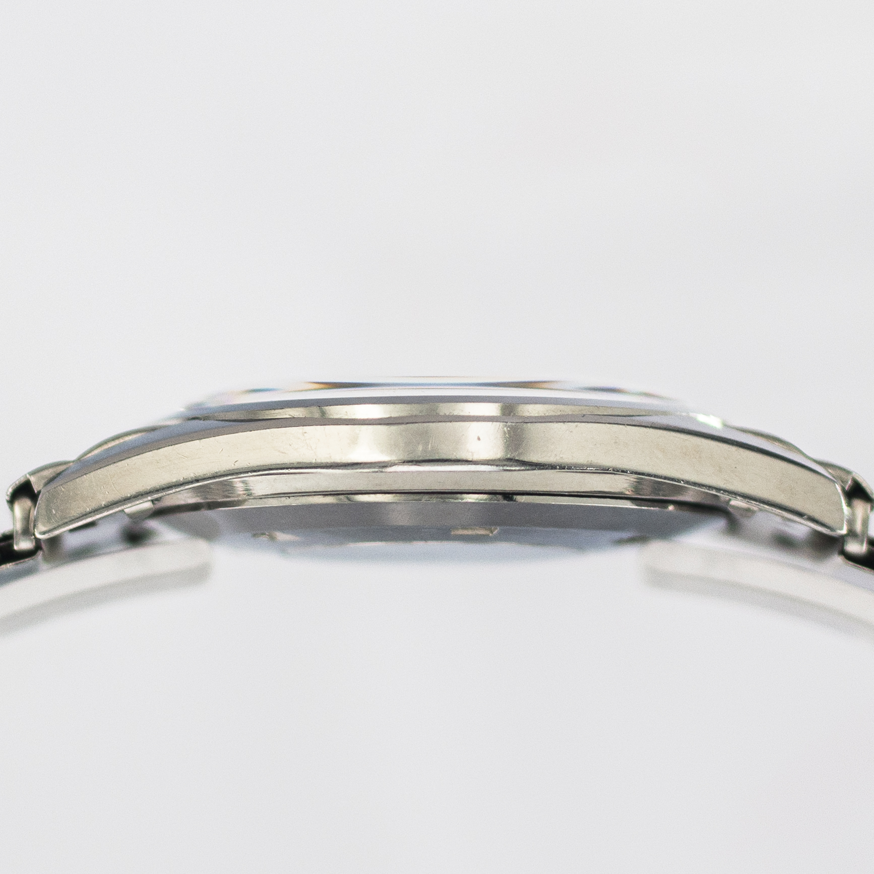 1628_marcels_watch_group_wristwatch_1957_vintage_longines_9100_4_silvergines_case_side_01